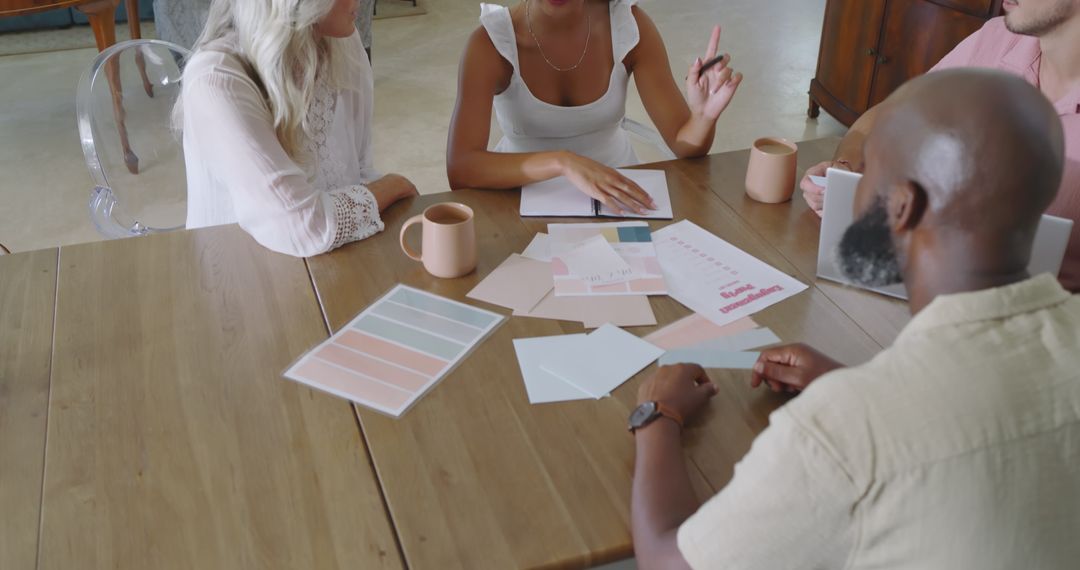 Diverse Team Collaborating on Wedding Planning Color Palette