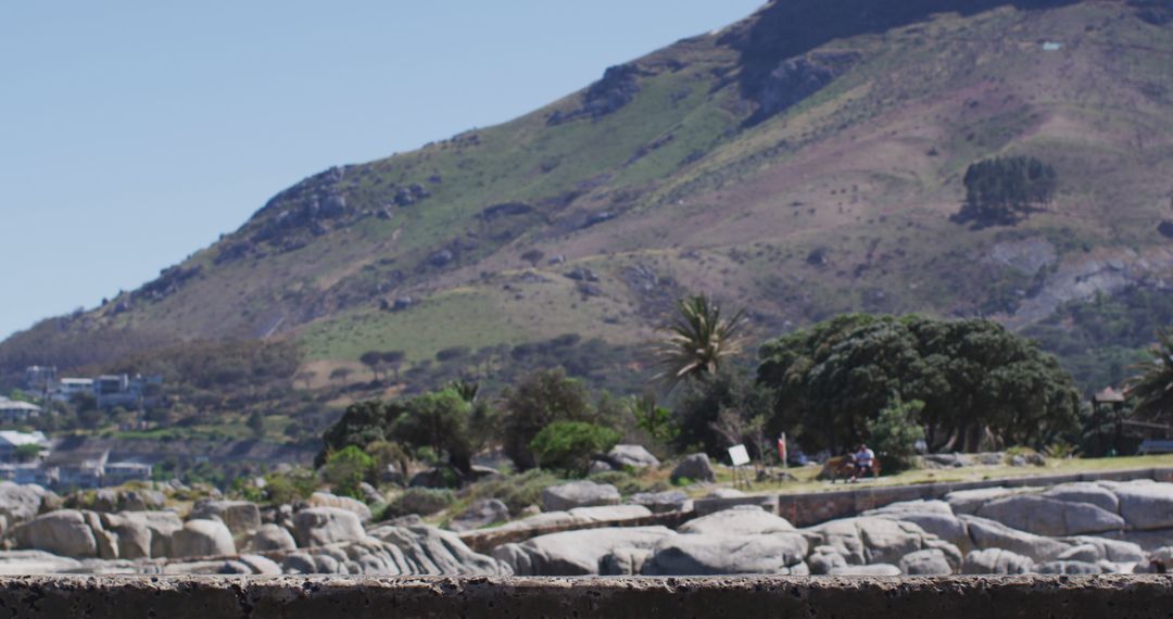 Serene Coastal Landscape with Mountains and Rocks - Free Images, Stock Photos and Pictures on Pikwizard.com