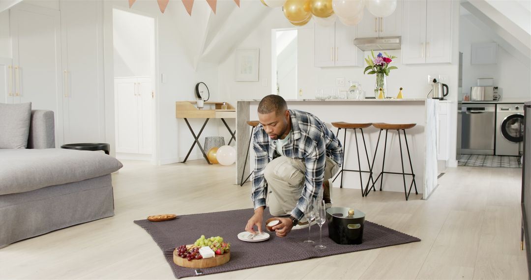 Man Preparing Romantic Anniversary Party with Wine and Food at Home