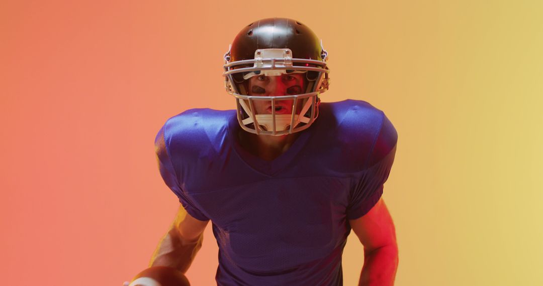 American Football Player in Action Pose with Gradient Background - Free Images, Stock Photos and Pictures on Pikwizard.com