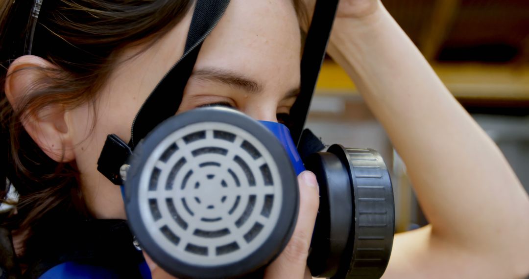 Woman wearing gas mask for safety and protection - Free Images, Stock Photos and Pictures on Pikwizard.com