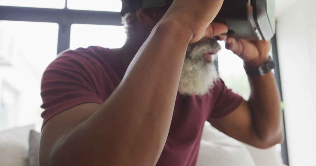 Image of african american senior man using vr headset - Free Images, Stock Photos and Pictures on Pikwizard.com