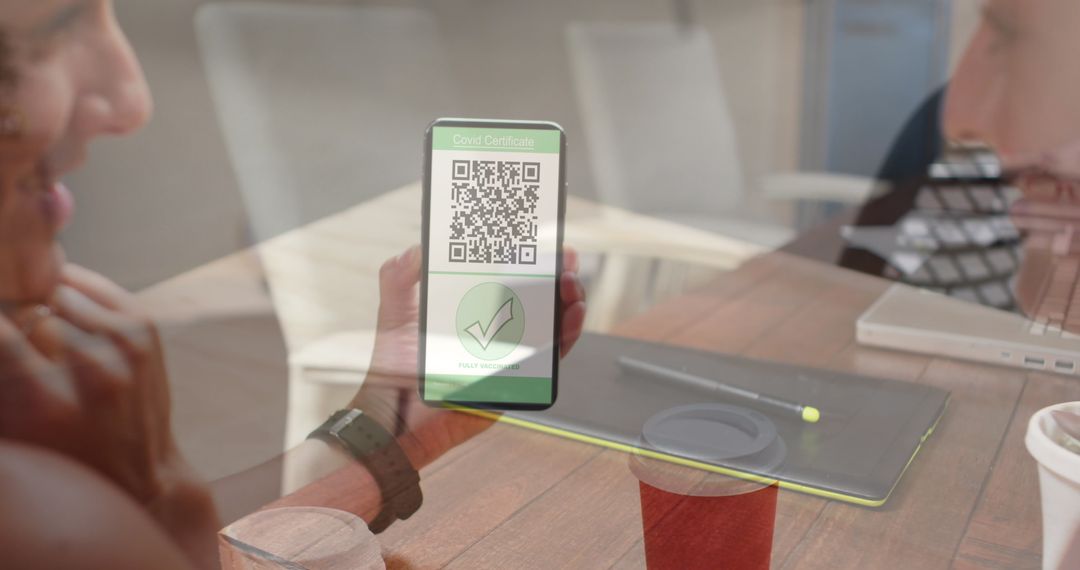 Digital Vaccination Passport Displayed on Smartphone in Office