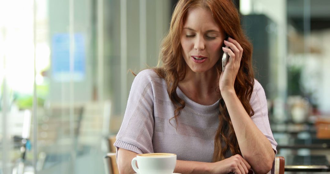 Woman talking on phone in cafe - Free Images, Stock Photos and Pictures on Pikwizard.com