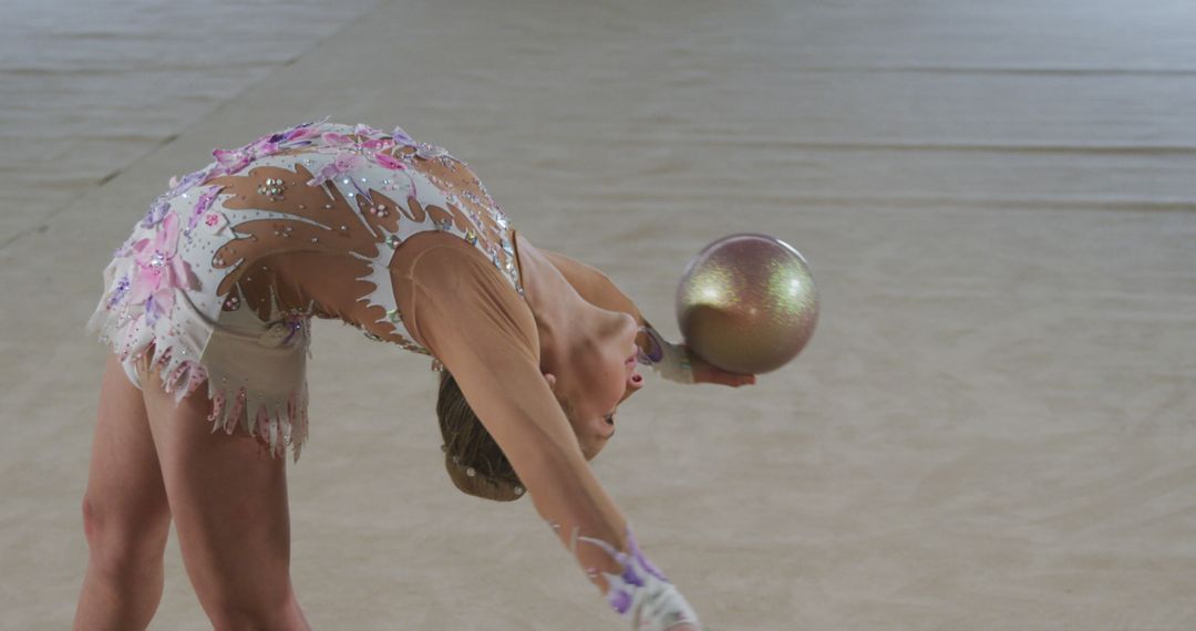 Gymnast Performing Rhythmic Gymnastics Routine with Ball - Free Images, Stock Photos and Pictures on Pikwizard.com