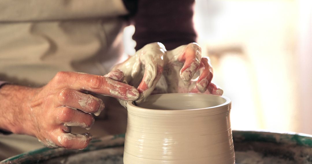 Close-up of Hands Shaping Pottery on Wheel - Free Images, Stock Photos and Pictures on Pikwizard.com