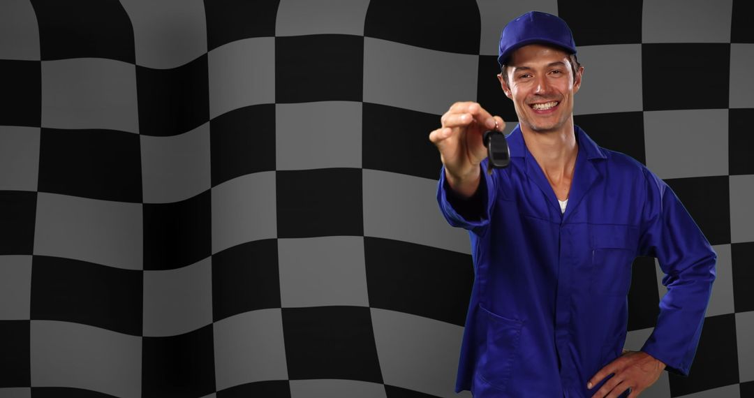 Smiling Driver Presenting Car Keys in Front of Checkered Flag