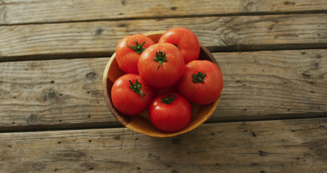 Image of fresh tomatoes in bowl over wooden background - Free Images, Stock Photos and Pictures on Pikwizard.com