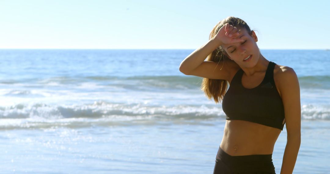 Tired fit woman standing in the beach 4k - Free Images, Stock Photos and Pictures on Pikwizard.com