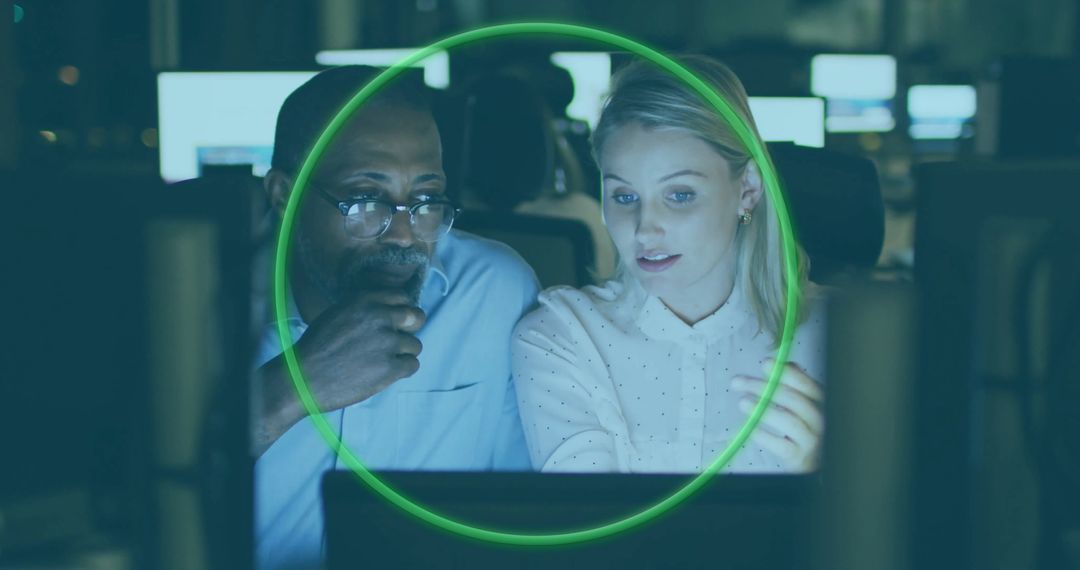 Collaborative Professionals Analyzing Data on Computer Screens