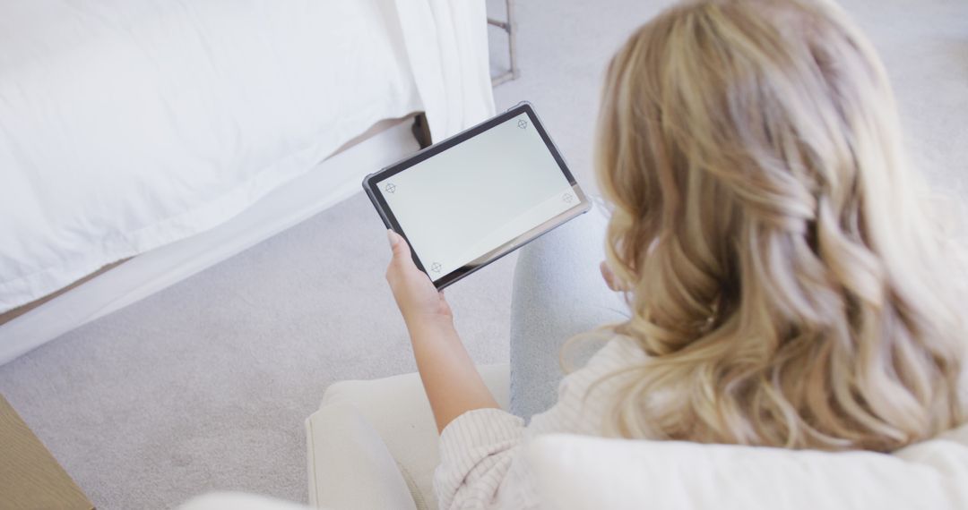 Woman Browsing on Digital Tablet in Cozy Bedroom - Free Images, Stock Photos and Pictures on Pikwizard.com