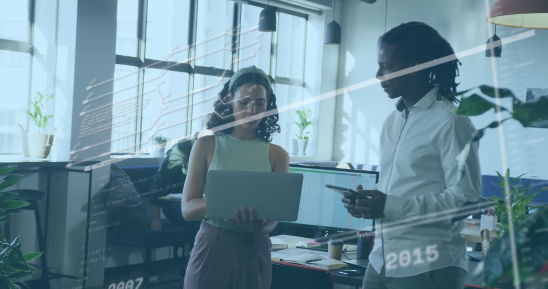 Tech-savvy team collaborating on code in open workspace