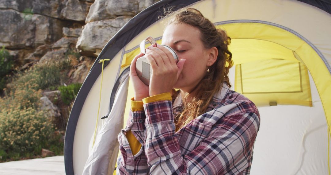 Woman Drinking Tea Outside Tent While Camping in Nature - Free Images, Stock Photos and Pictures on Pikwizard.com