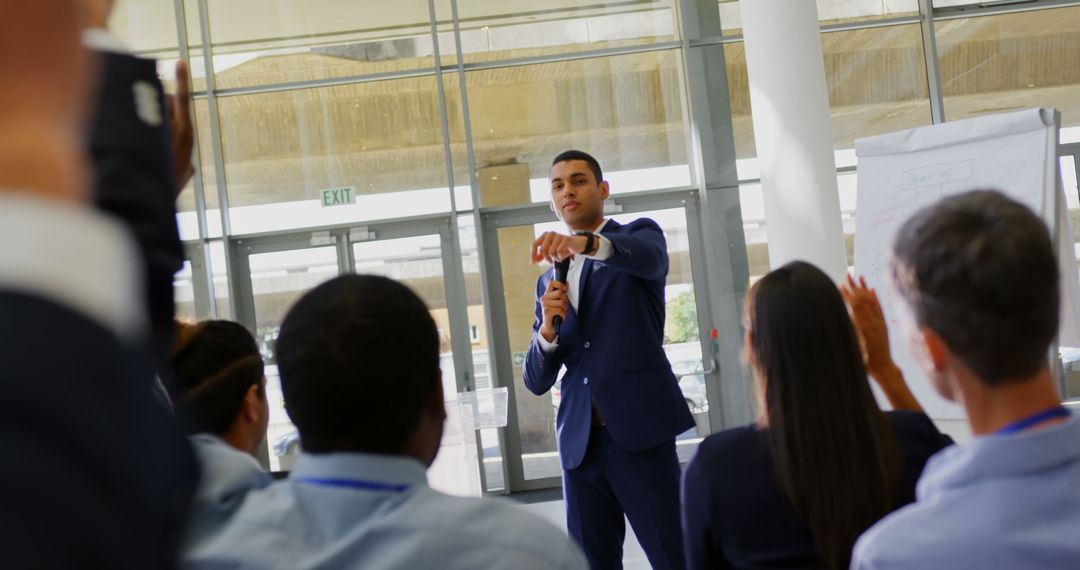 Confident Business Leader Presenting to Diverse Audience