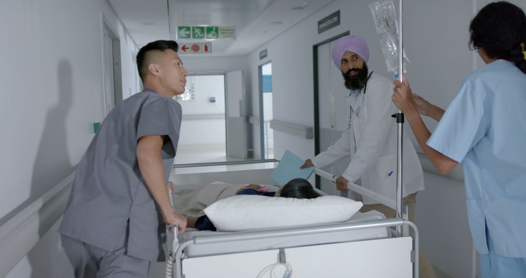 Medical Staff Transporting Patient Through Hospital Hallway - Free Images, Stock Photos and Pictures on Pikwizard.com