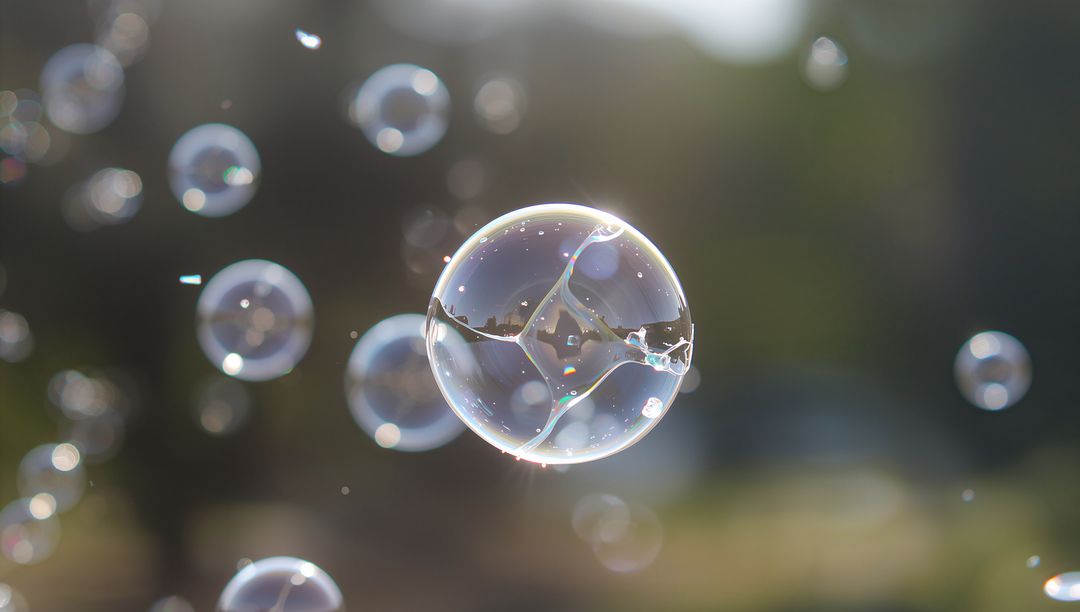 Iridescent Soap Bubble Floating in Sunlit Park with Bokeh Reflections and Smaller Orbs