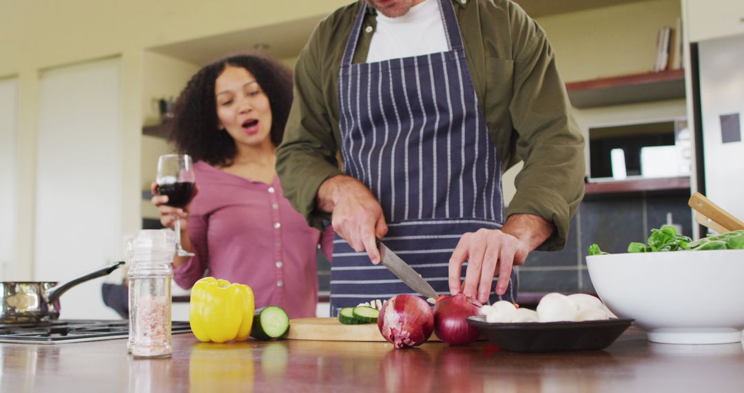 Joyful Couple Cooking and Bonding in Modern Kitchen