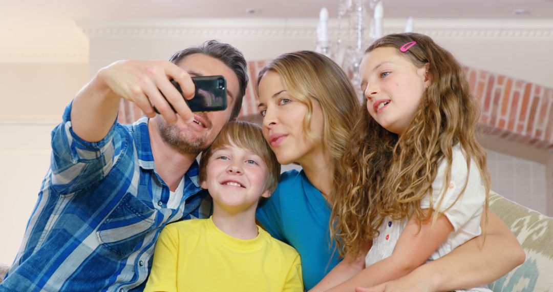 Happy family taking selfie smiling together in living room - Free Images, Stock Photos and Pictures on Pikwizard.com