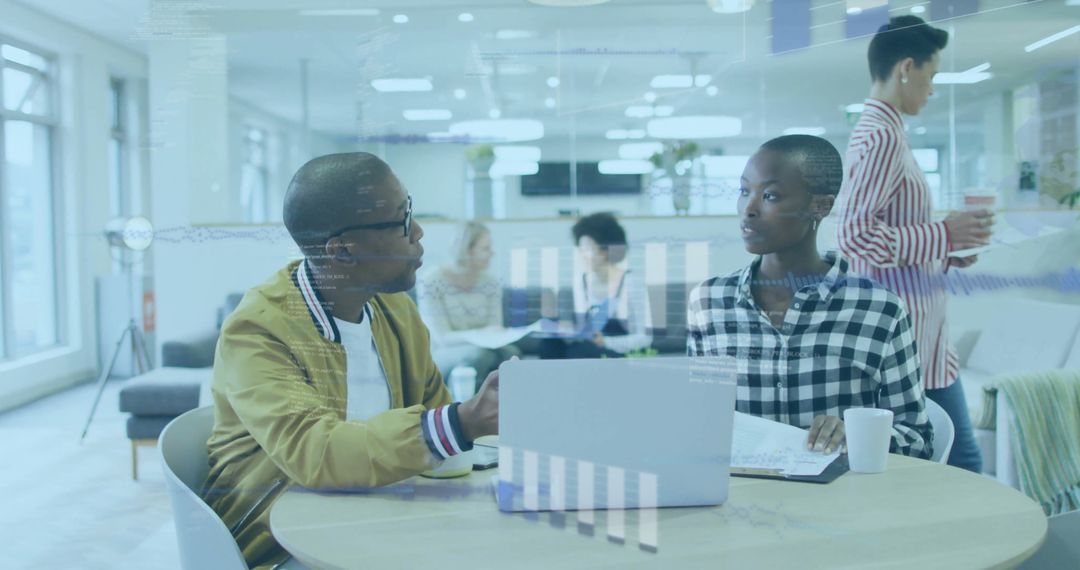 Diverse Business Team Engaging in Data Analysis in Modern Office