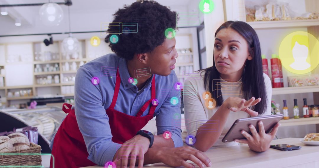 Diverse Shop Assistant Discussing Digital Solutions with Customer