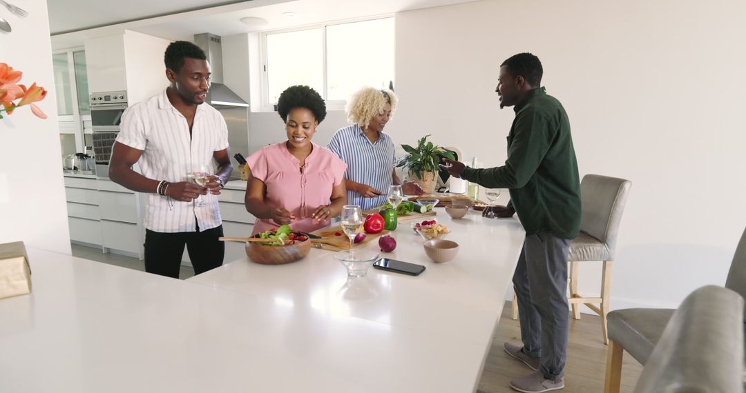 Friends Collaborating in Modern Kitchen for Group Meal