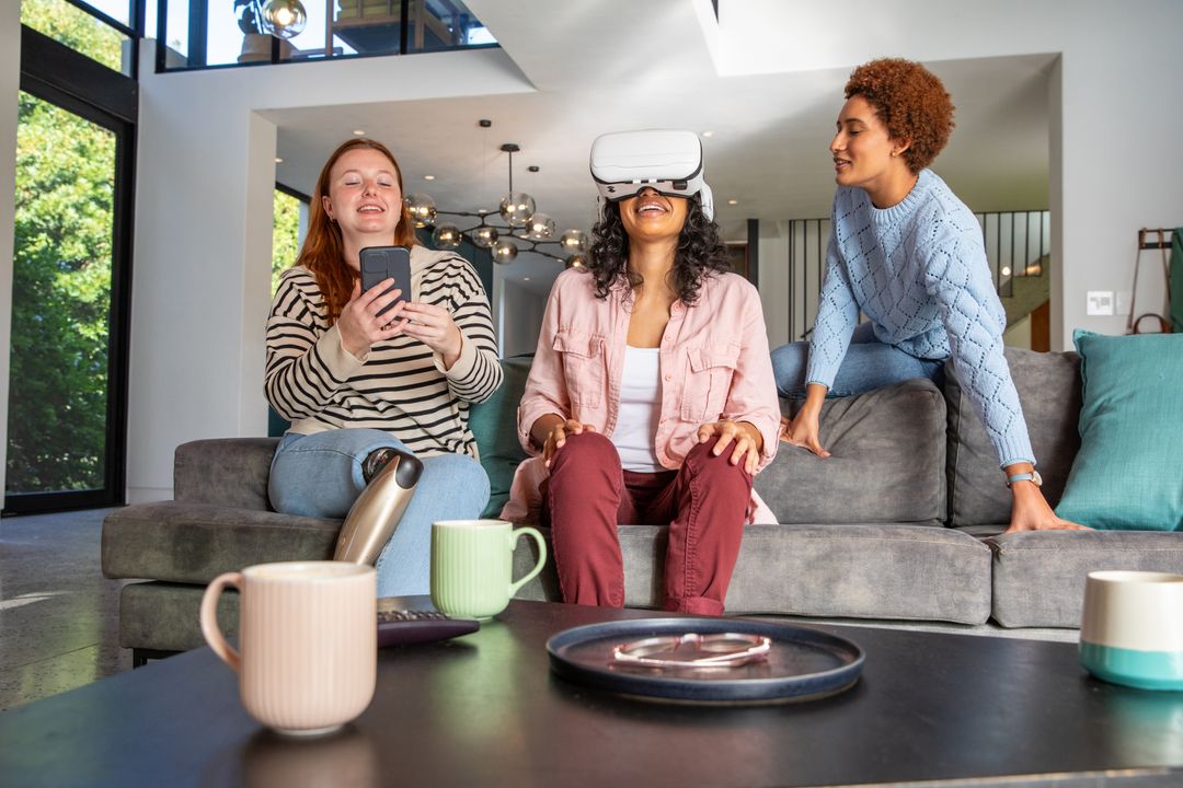 Diverse Friends Enjoying Virtual Reality and Smartphone at Home
