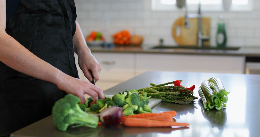 Caucasian Woman Preparing Fresh Vegetables in Modern Home Kitchen - Free Images, Stock Photos and Pictures on Pikwizard.com