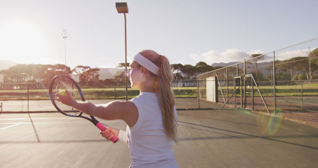 Woman Practicing Tennis Serve at Sunrise - Free Images, Stock Photos and Pictures on Pikwizard.com