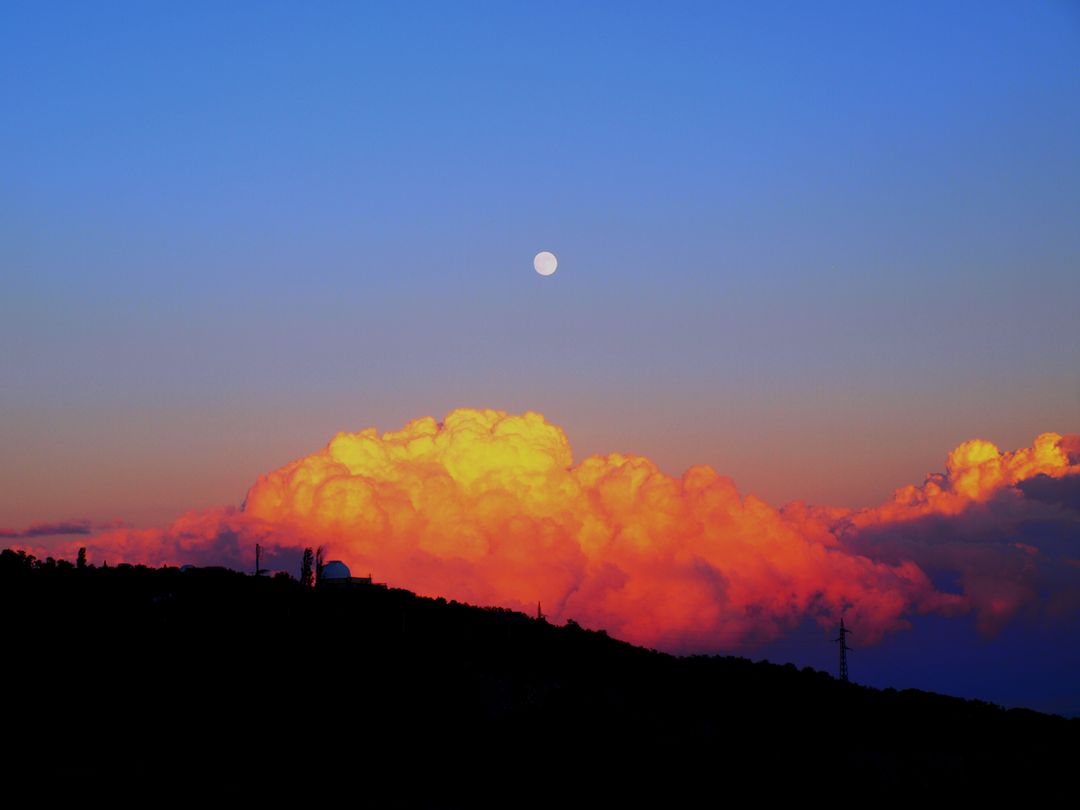 Vibrant Sunset with Full Moon and Silhouette of Mountain Observatory - Free Images, Stock Photos and Pictures on Pikwizard.com