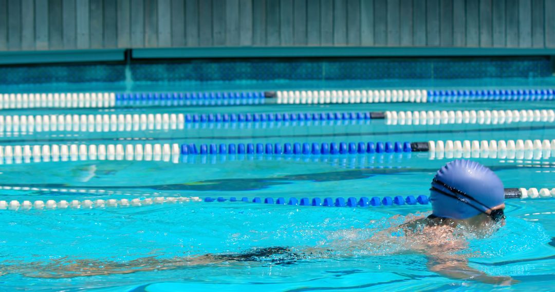 Swimmer Practicing Freestyle Stroke in Indoor Swimming Pool - Free Images, Stock Photos and Pictures on Pikwizard.com