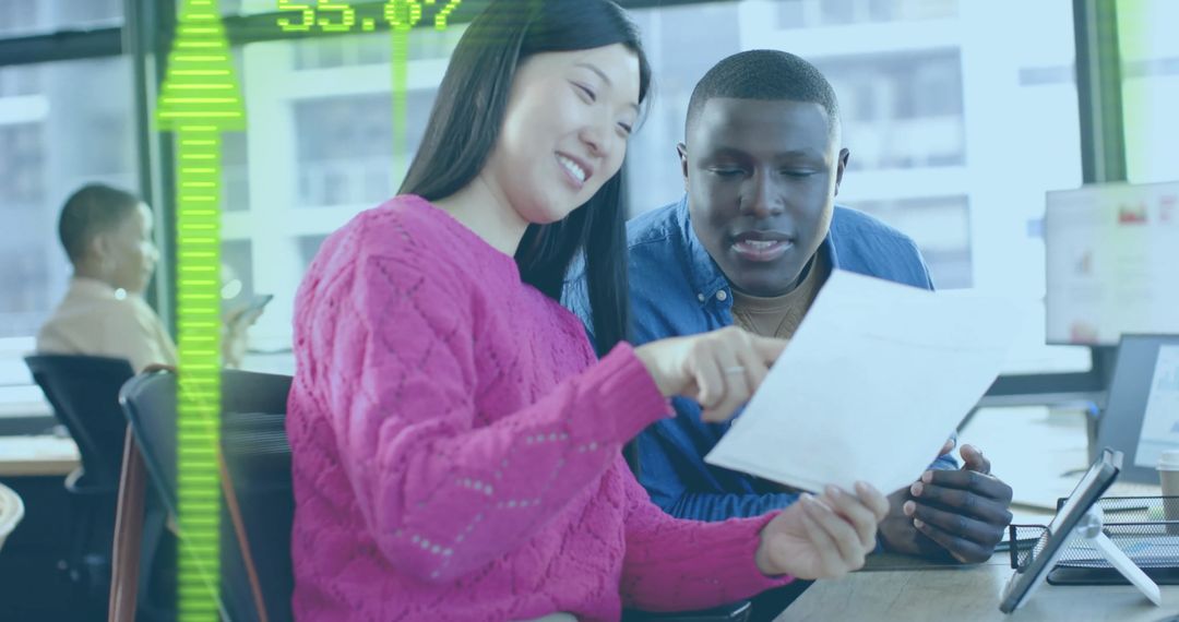 Diverse Business Team Analyzing Financial Documents in Office