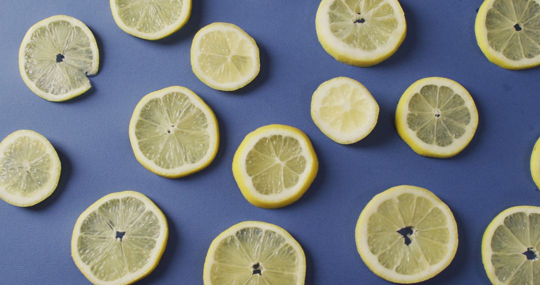 Fresh Lemon Slices on Blue Background - Free Images, Stock Photos and Pictures on Pikwizard.com