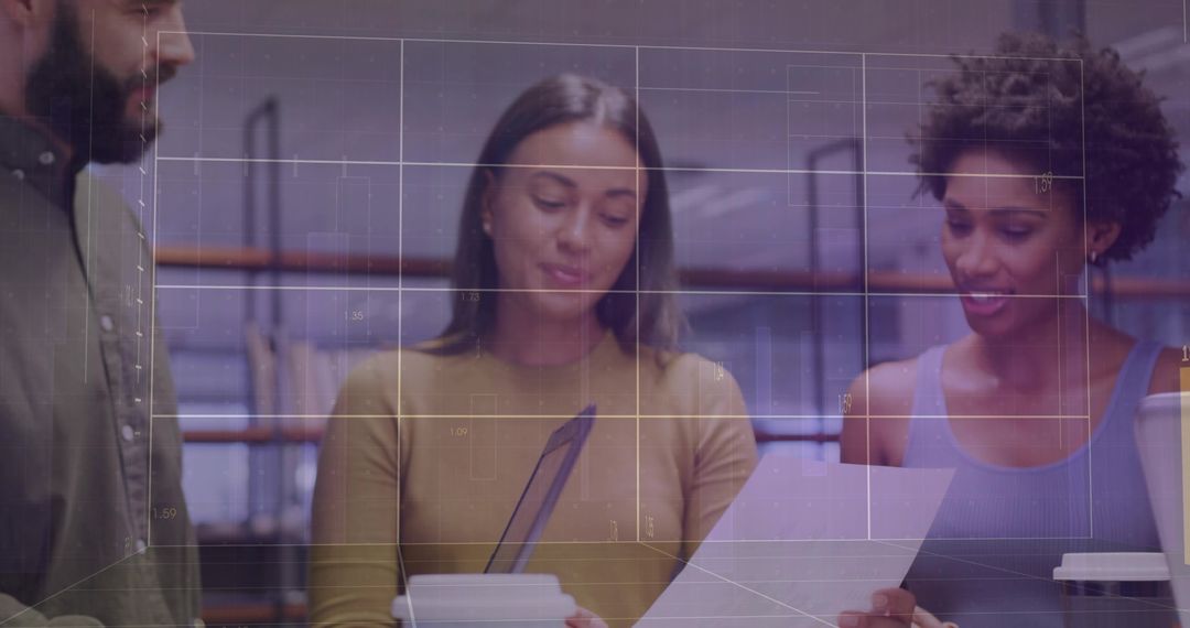 Professional Team Collaborating on Documents at Modern Workspace