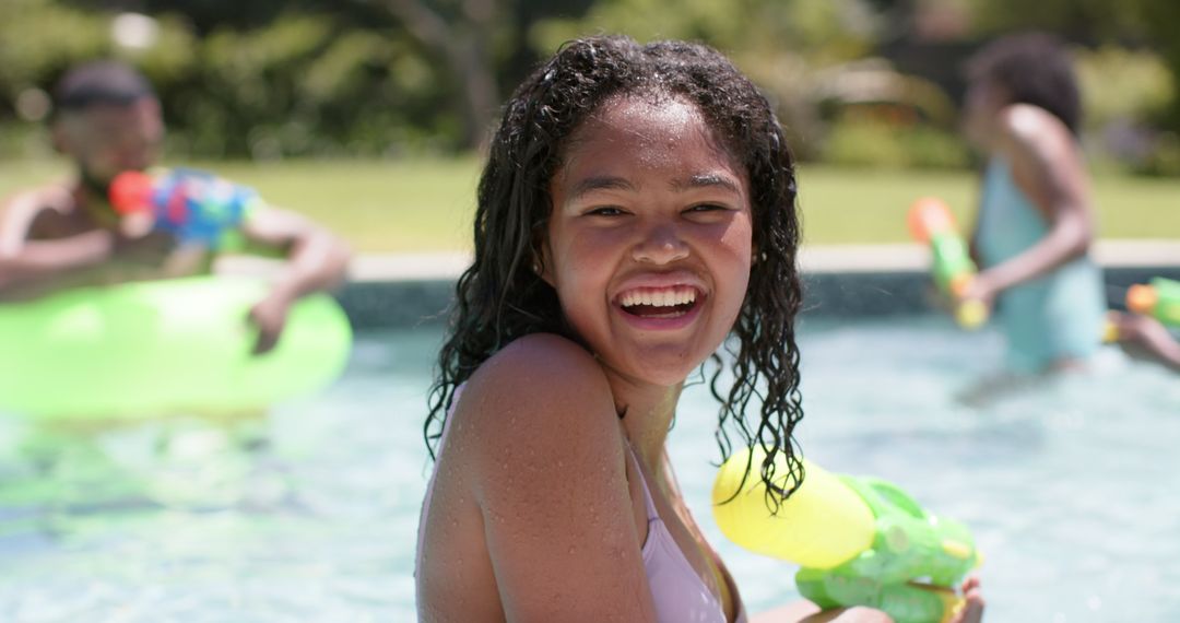 Joyful Girl Playing in Pool During Summer