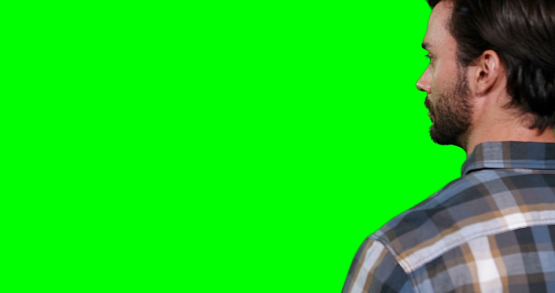 Man Using Interactive Display on Green Screen Background