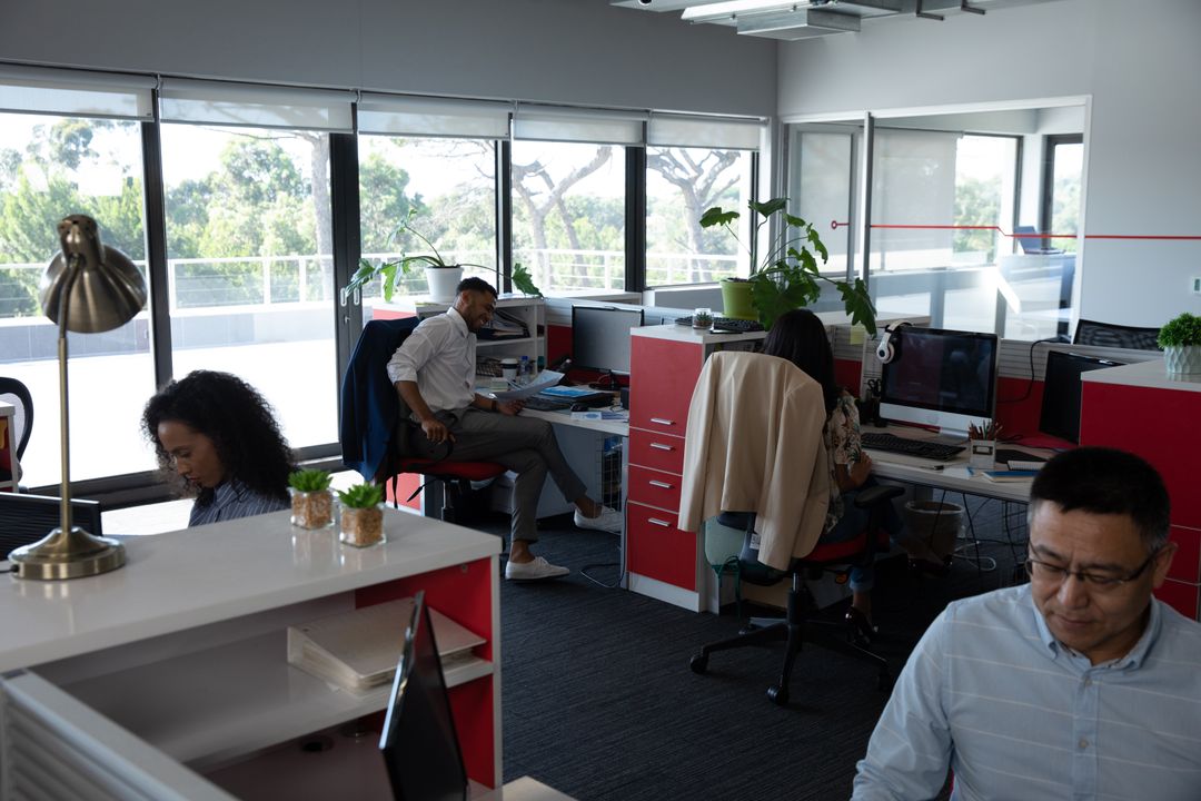 Diverse Professionals Engaged in Modern Office Environment