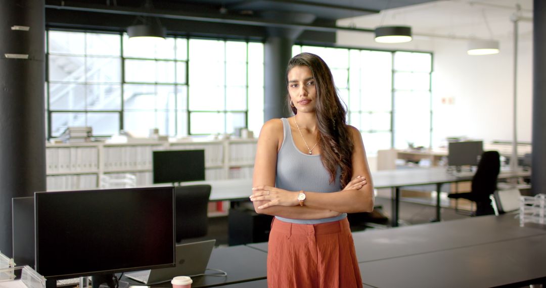 Confident Indian Professional Standing in Modern Office
