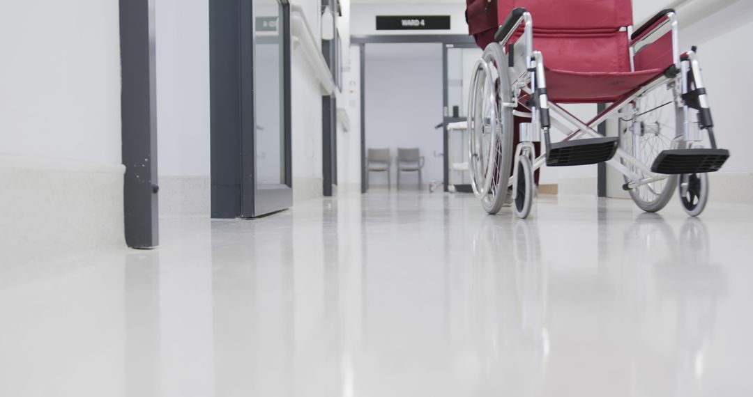 Empty Wheelchair in Hospital Corridor Reflects Clean and Sterile Environment - Free Images, Stock Photos and Pictures on Pikwizard.com