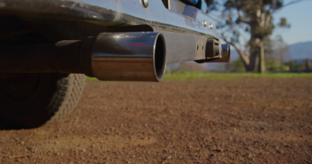 Close-Up of Car Exhaust Pipe in Rural Setting - Free Images, Stock Photos and Pictures on Pikwizard.com