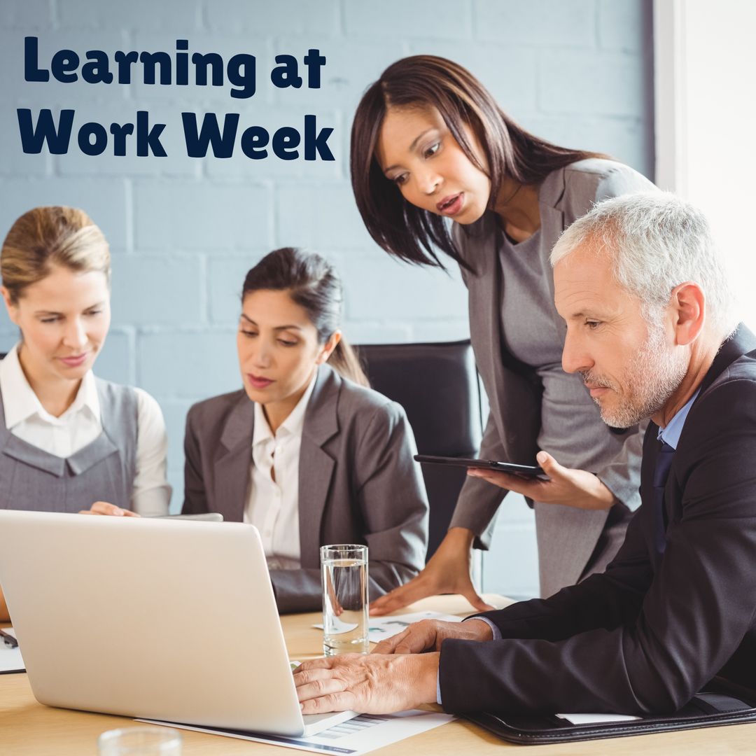 Professional Team Collaborating During Training Week in Office