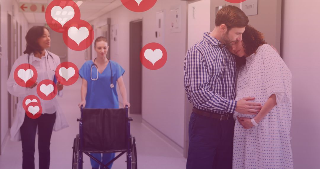 Expectant Couple Sharing Emotional Moment in Hospital Corridor - Free Images, Stock Photos and Pictures on Pikwizard.com