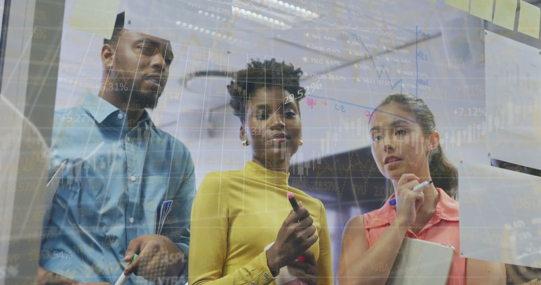 Multicultural Team Analyzing Global Financial Data in Office