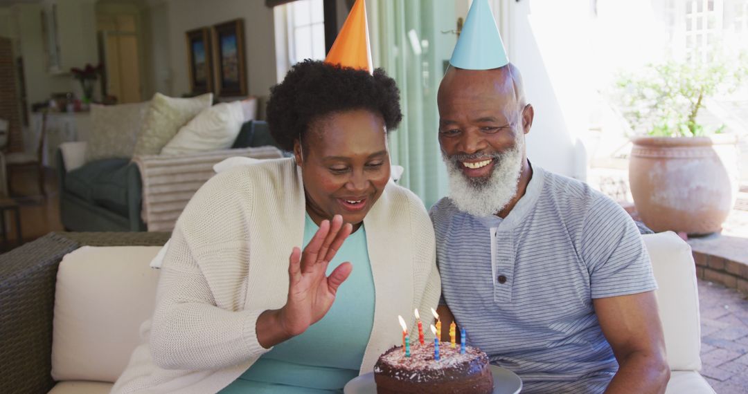 Senior African American Couple Celebrating Birthday with Cake - Free Images, Stock Photos and Pictures on Pikwizard.com