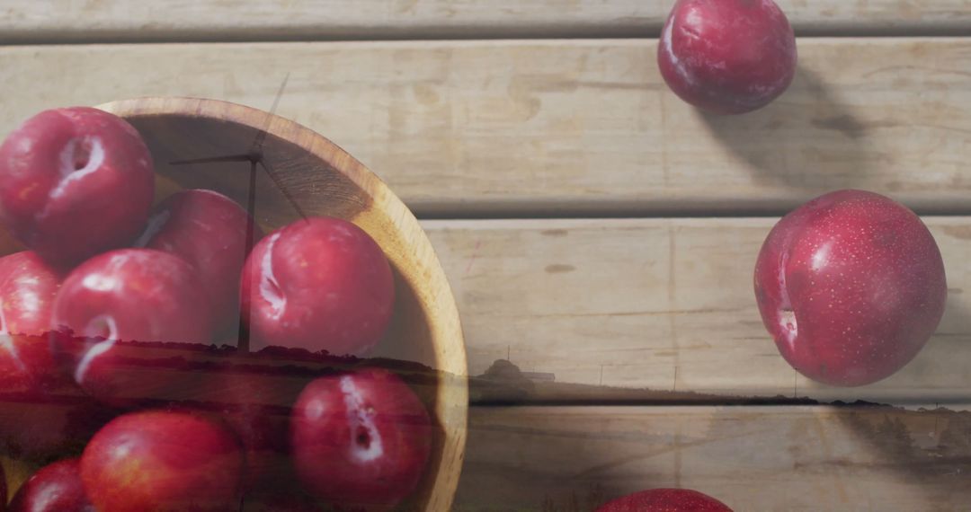 Fresh Red Plums in Wooden Bowl on Rustic Wooden Table