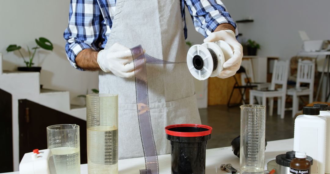 Close-Up of Person Developing Film Reel in Darkroom - Free Images, Stock Photos and Pictures on Pikwizard.com