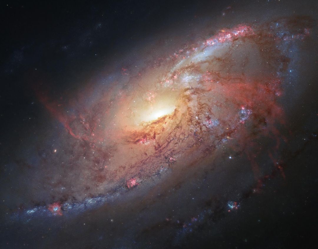Stunning Spiral Galaxy M106 with Anomalous Arms and Glowing Hydrogen - Free Images, Stock Photos and Pictures on Pikwizard.com