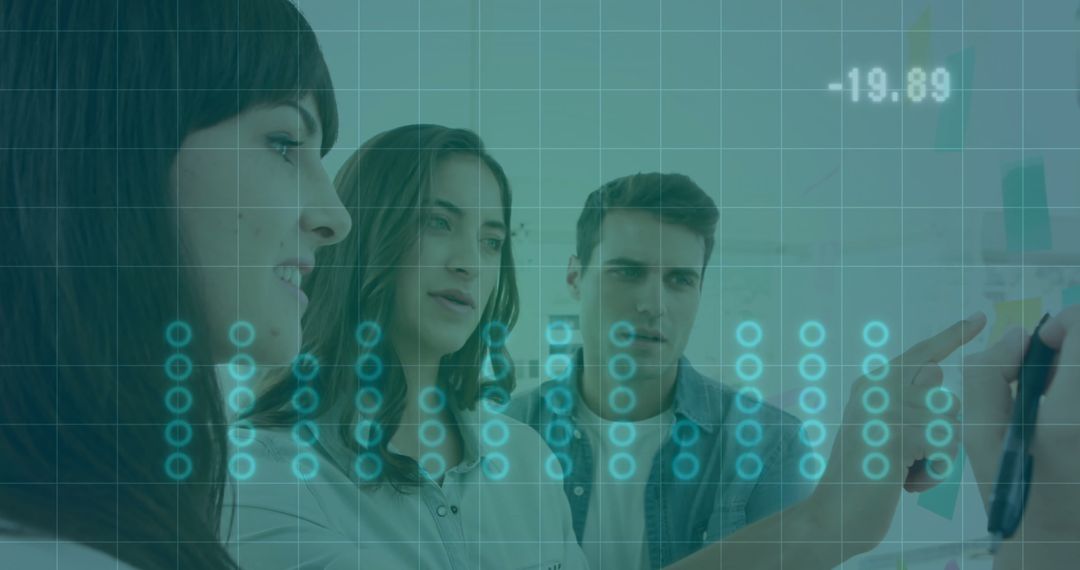 Business Team Collaborating on Graphical Trends and Analysis in Office