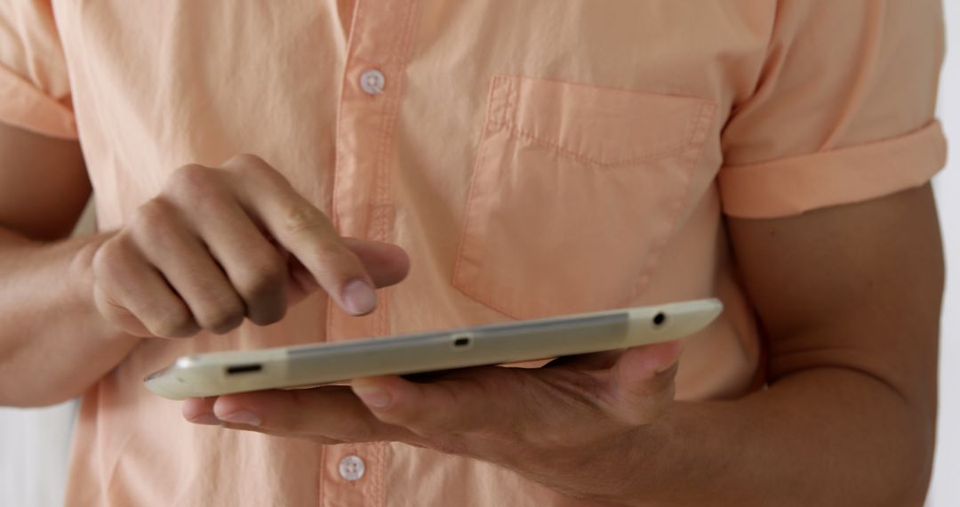 Close Up of Person Using Tablet, Casual Shirt - Free Images, Stock Photos and Pictures on Pikwizard.com