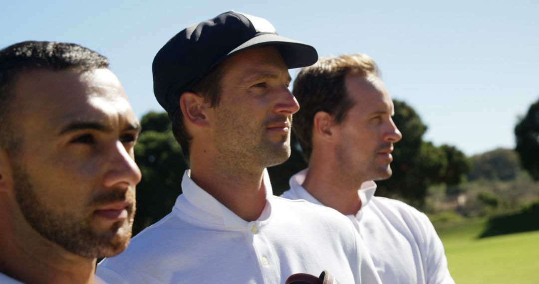 Confident Male Athletes Standing on Golf Course in White Polo Shirts - Free Images, Stock Photos and Pictures on Pikwizard.com