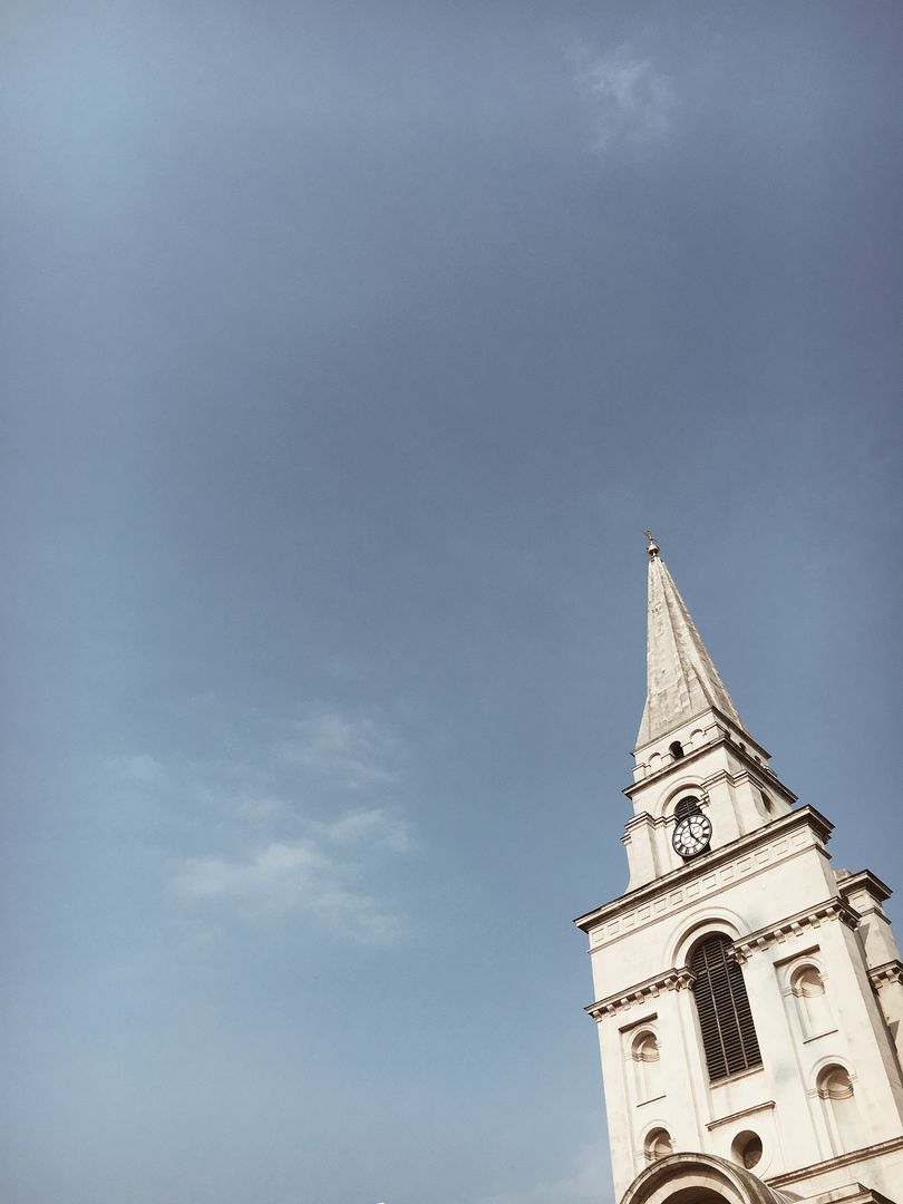 Historic Church Tower Under Clear Blue Sky - Free Images, Stock Photos and Pictures on Pikwizard.com